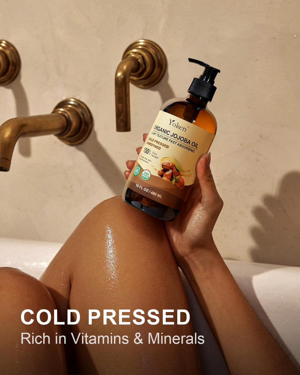Yoken jojoba oil on hair for soft, shiny strands.
