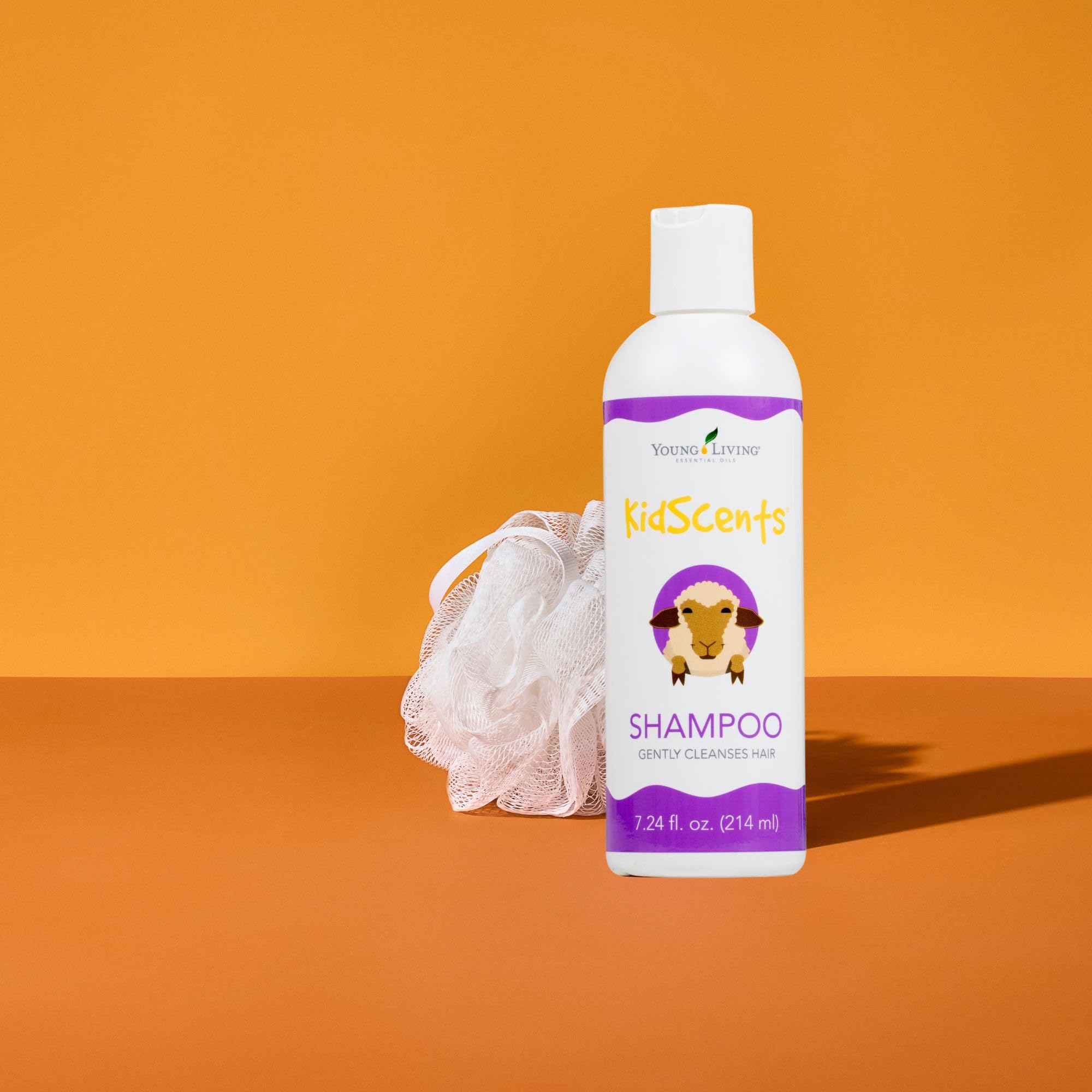 Young Living KidScents Shampoo lather demonstrates soft hair post-wash.