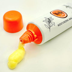Cream texture appears non-greasy and quickly absorbing for face and hands.