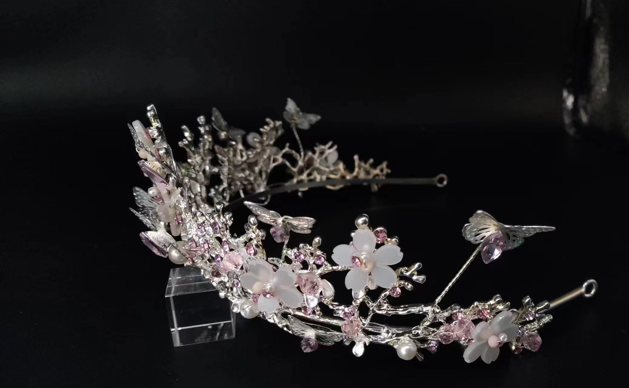 Yunyuebridal sparkling crown on display emphasizing height and shine.