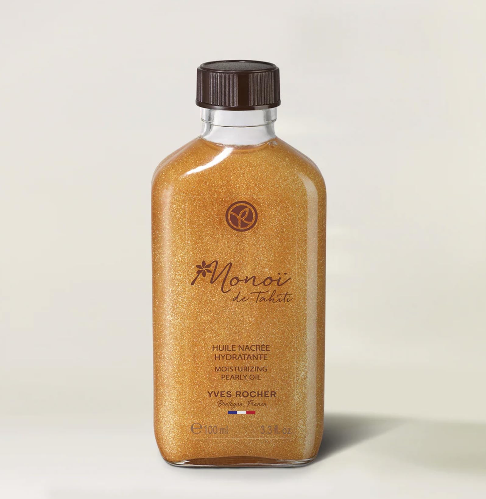 Yves Rocher Monoï Tahiti oil droplets illustrating quick absorption on skin.