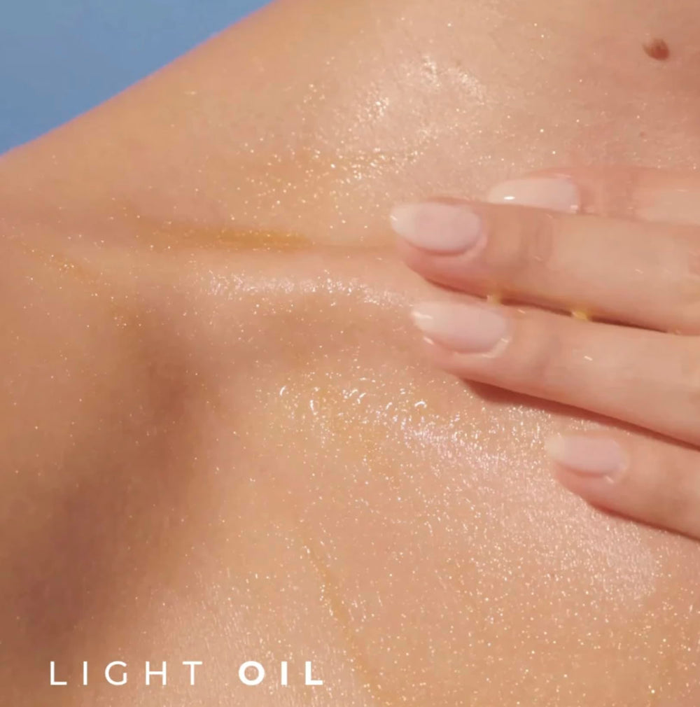 Yves Rocher Monoï Tahiti oil applied to skin for a luminous finish.