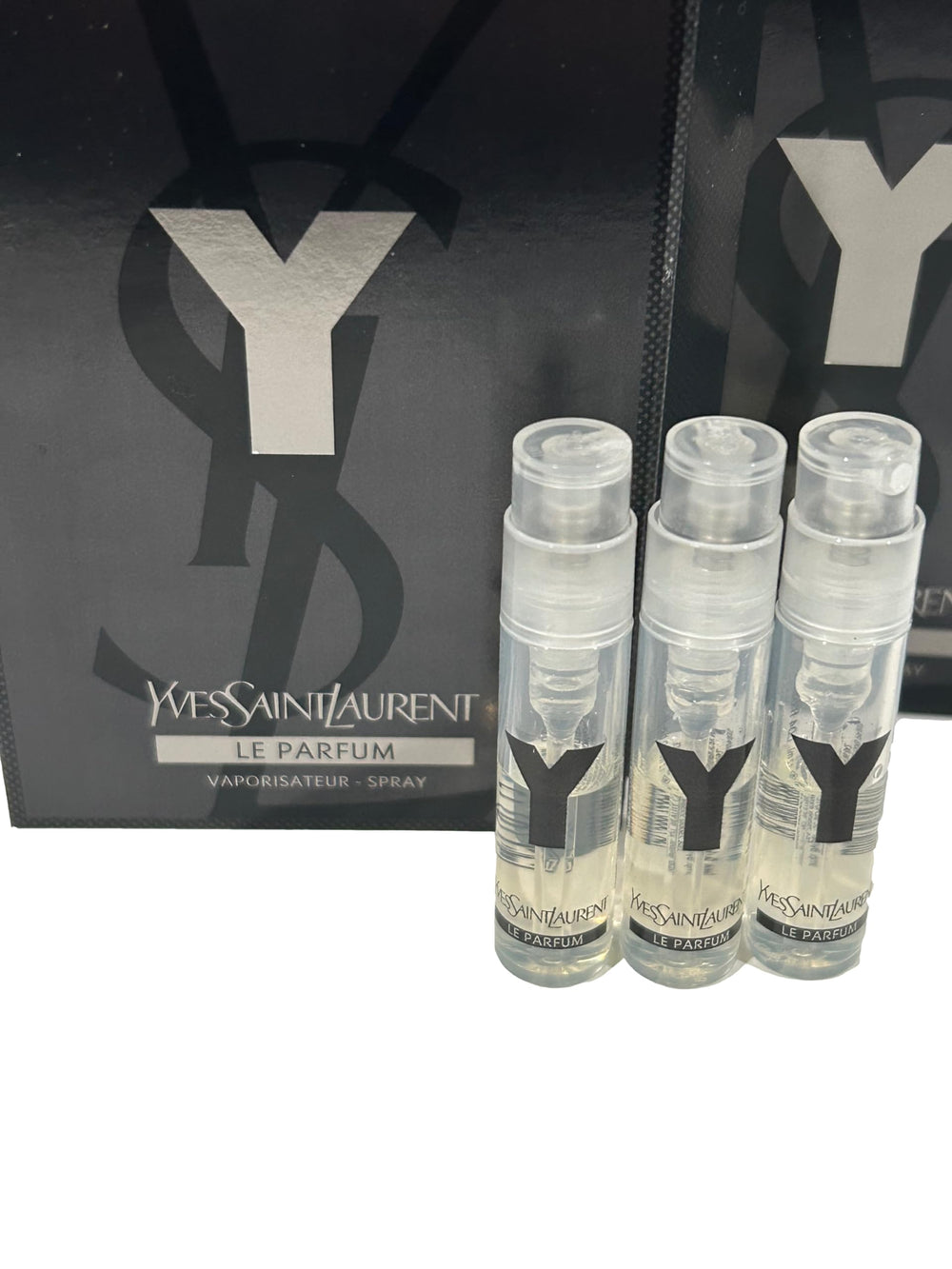 Close-up of YSL Y Men LE PARFUM spray cap for compact travel use