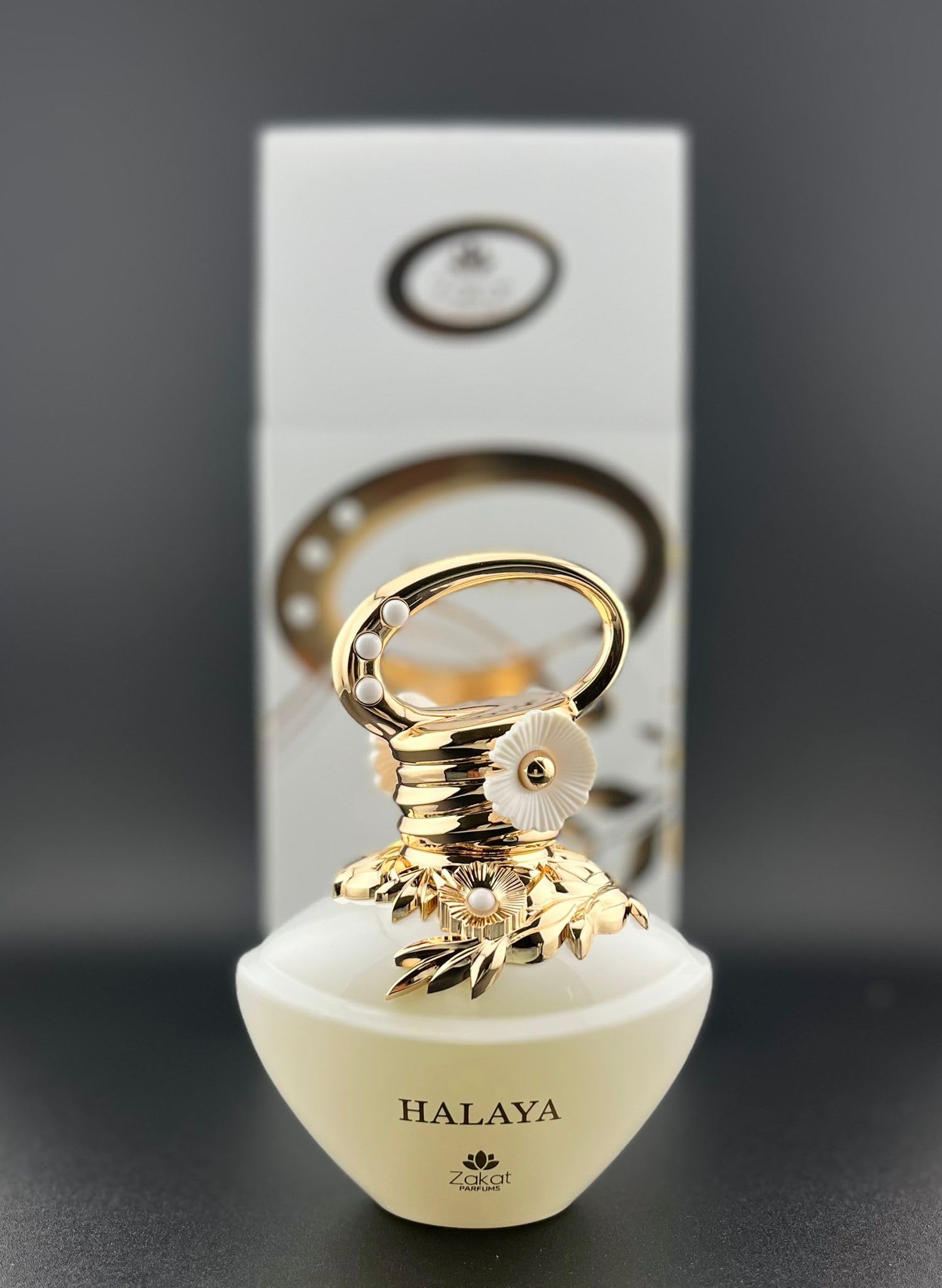 Zakat Parfums HALAYA bottle closeup shows embossed florals and a pearlescent finish