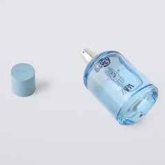 Zara Bluey Ludo Studio kid applying spray for a playful, fresh scent.