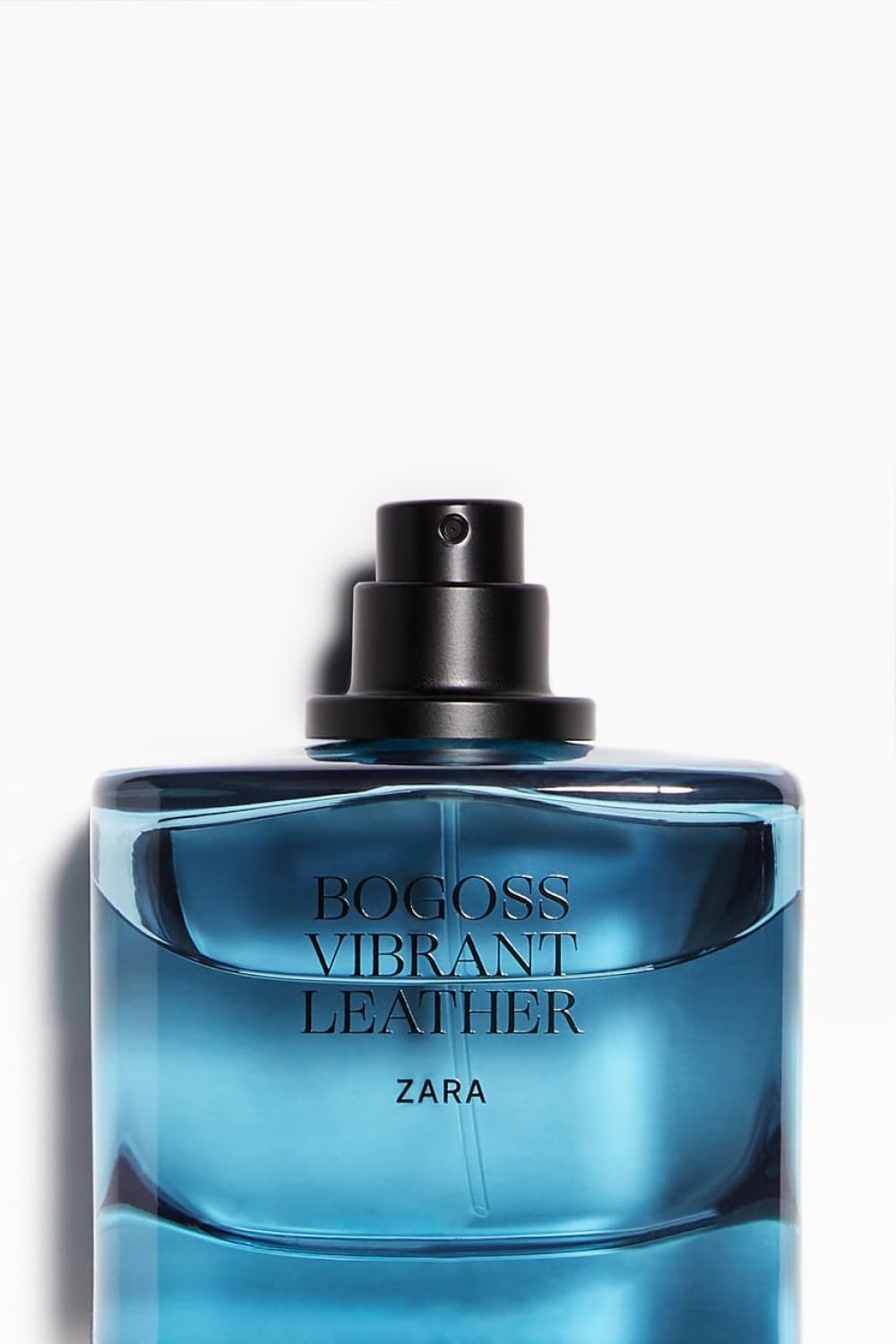 Zara Bogoss Vibrant Leather bottle under warm light, versatile scent from day to night.