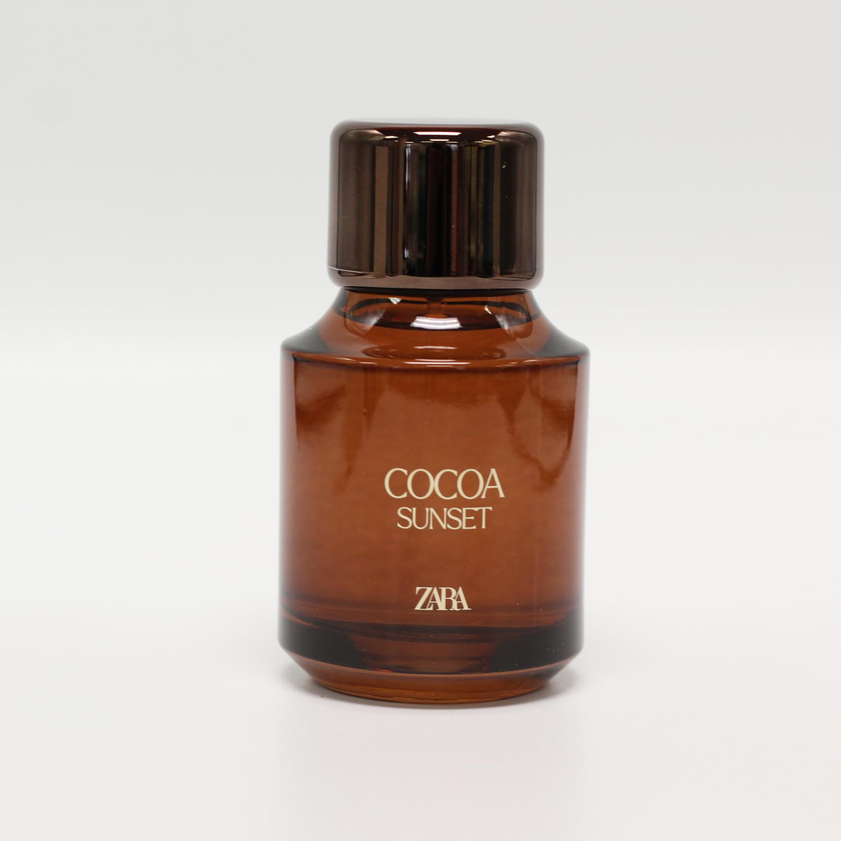 Zara Cocoa Sunset bottle closeup highlights creamy chocolate notes.