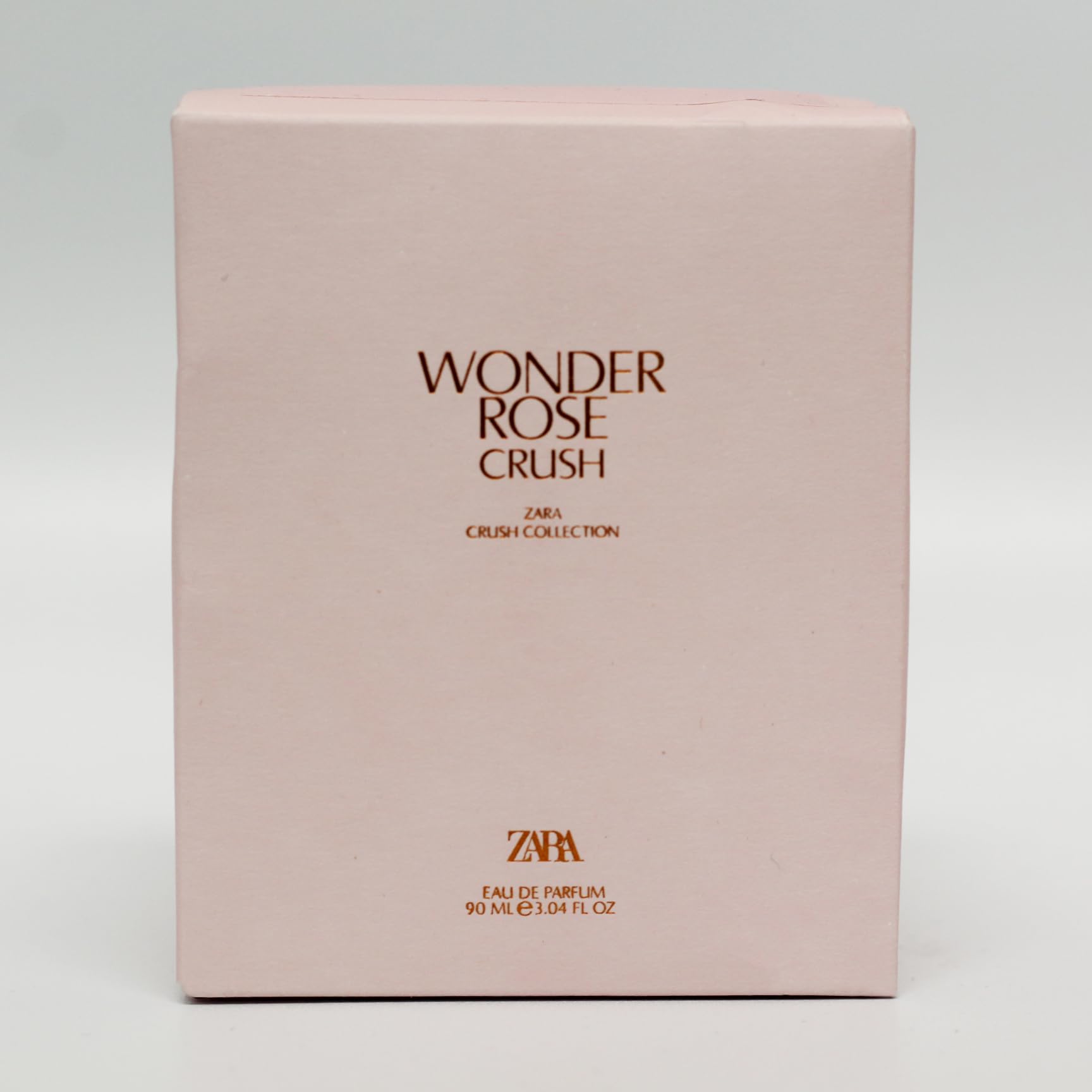 Signature glass bottle highlights the modern rose heart and elegant style.