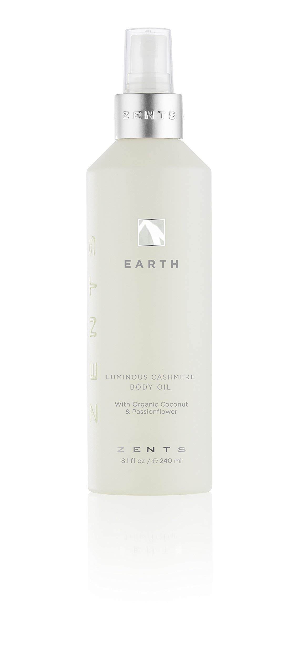 Zents Luminous Cashmere Body Oil Earth fragrance bottle pour for radiant hydration.