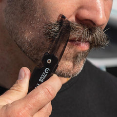 ZEUS pocket-size folding-comb ready for daily carry and travel grooming.
