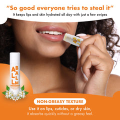 Zizia balm stick applied to elbows to soften dry skin