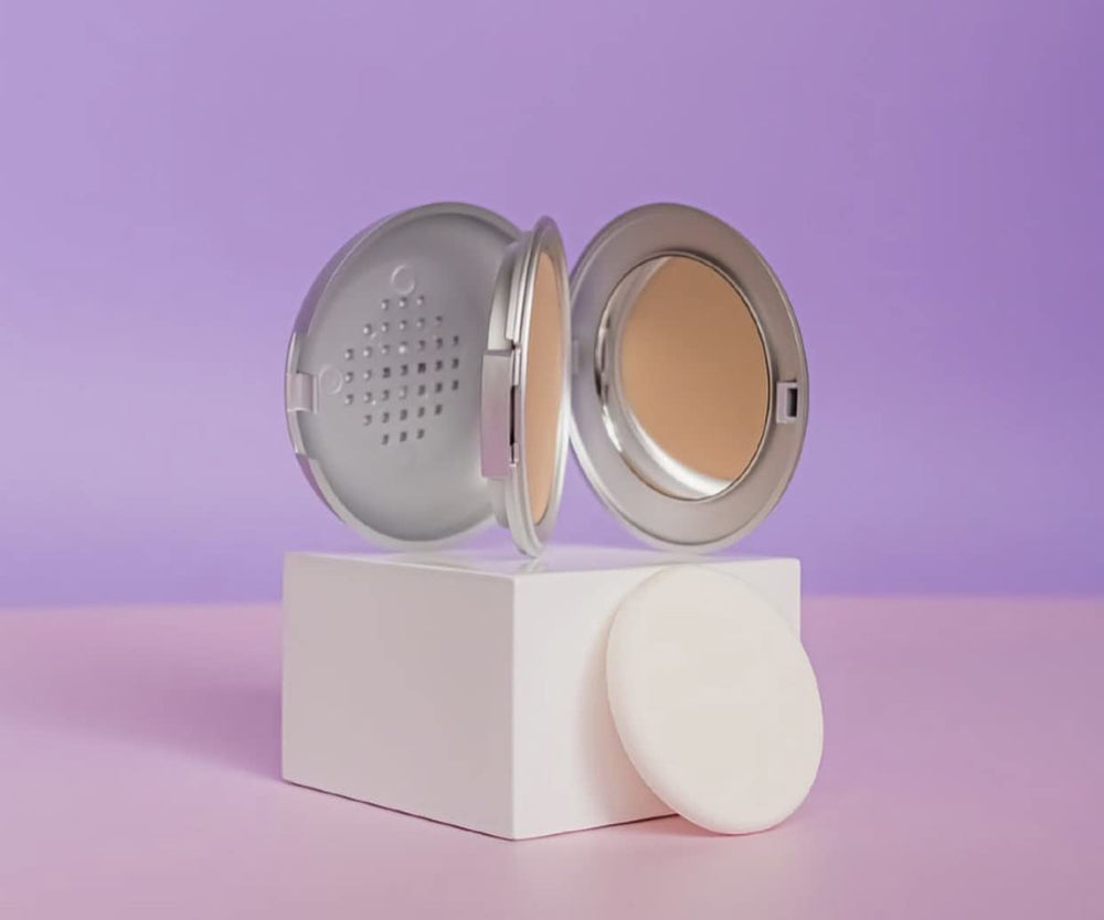 D-20 compact opened showing smooth texture detail.